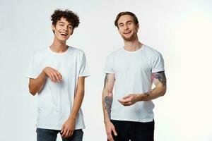 two friends in white t-shirts communication fun positive photo