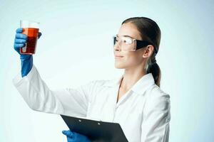 female laboratory assistant research biotechnology professional analyzes photo