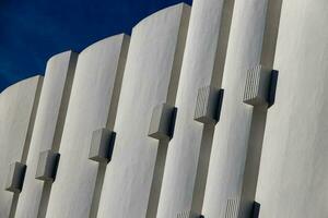 interesting original elements of the balconies in the white building photo