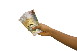 Fair hand holding 3D rendered Jordanian dinar notes isolated on transparent background png