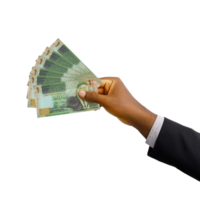 Black hand with suit holding New Jordanian Dinar notes isolated on transparent background, 3d rendering png