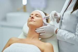 A scene of medical cosmetology treatments botulinum injection. photo