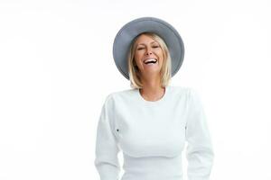 Picture of blonde woman isolated over white background wearing hat photo