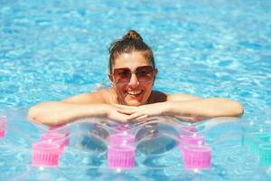 Close up images of a woman in the pool photo