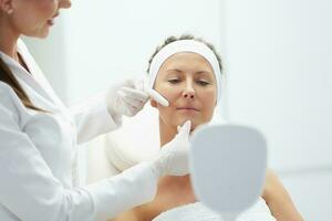 A scene of medical cosmetology treatments botulinum injection. photo