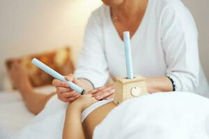 Picture of moxibustion therapy on woman body photo