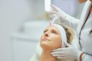 A scene of medical cosmetology treatments botulinum injection. photo