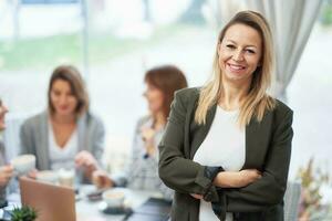 Portrait of mature young business woman in restaurant photo