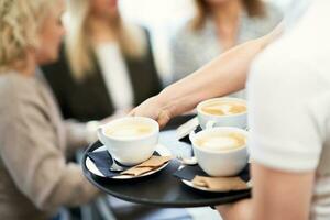 Picture of coffee on business meeting in restaurant. photo