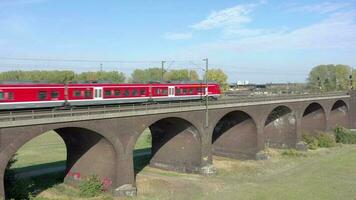 Commuter Train Passing Fast Over an Old Bridge video