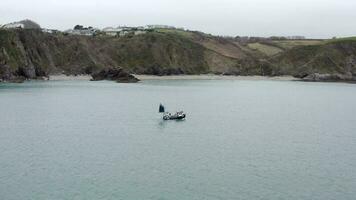 Fishing Boat Pulling Nets on a Grey Day Aerial Shot video