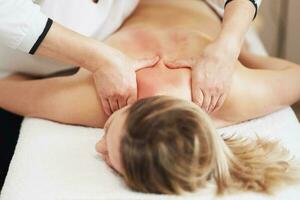 Woman having back body massage in studio photo