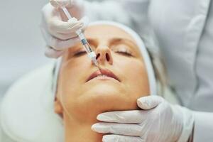 A scene of medical cosmetology treatments botulinum injection. photo