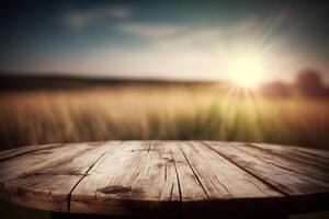 Empty wooden round table for product display with blurred field background. photo