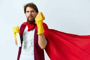 cleaner in red raincoat detergent house cleaning service light background photo