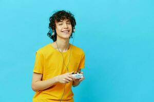 guy in headphones plays games gamepad isolated backgrounds photo