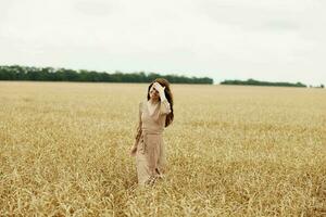 woman spikelets of wheat harvesting organic endless field photo