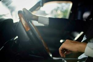 bearded man in a suit in a car a trip to work self confidence photo