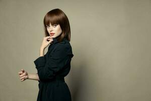 Woman in black coat model new autumn clothes photo