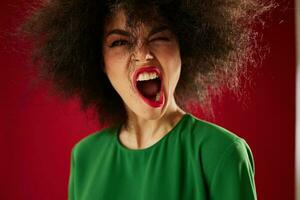 Young woman with curly hair grimace posing emotion studio model unaltered photo