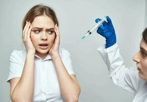 doctor blue gloves and woman syringe anesthesia botox injection photo