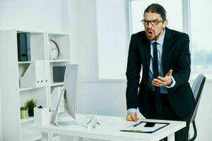 male manager in the office gestures with his hands Lifestyle photo