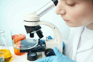 woman scientist microscope research microbiology close-up photo