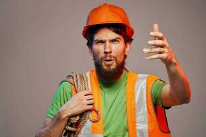 man in orange helmet work engineer professional tools photo