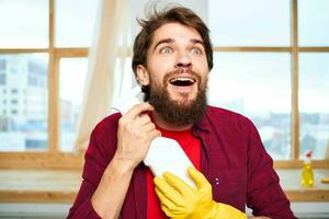 Professional janitor detergent rubber gloves interior window in the background providing lifestyle services photo