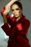 woman in red jacket bright makeup glamor attractive look photo