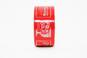 Red Fragile Tape Isolated on White Background photo