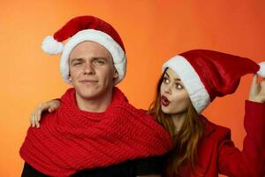 merry couple friendship christmas decoration fun red background photo