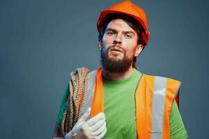 Man in orange paint professional engineer working construction photo