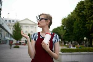 woman with short hair on the street wearing sunglasses photo