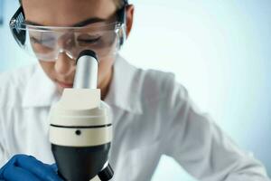 woman laboratory assistant microscope diagnostics research science photo