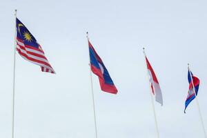 The flags of Association of Southeast Asian Nations the clear blue sky. photo