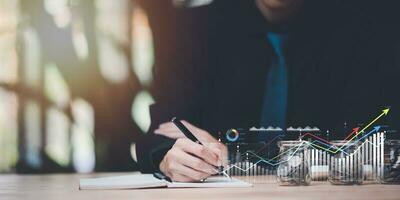 small business entrepreneur reading graph report and business statistics charts ,Analysis and management of financial and marketing documents ,Statistics and Data Concepts ,business growth graph photo