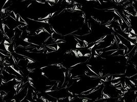 Black Background with Crumpled Transparent Plastic Wrap Texture photo