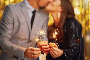 Couple at new year eve party with 2023 sparklers photo