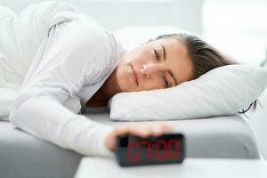 Young woman in the bed with sleep problems photo