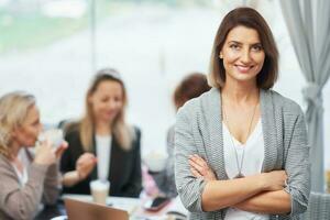 Portrait of mature young business woman in restaurant photo