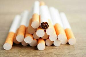 Cigarette, roll tobacco in paper with filter tube, No smoking concept. photo