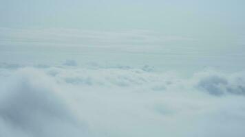 The beautiful mountains view surrounded by the misty fog in winter photo