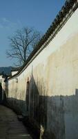 The beautiful traditional Chinese village view with the classical architecture and narrow lane  as background photo