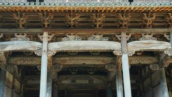 The old wooden Chinese house carved with the beautiful sculpture in the countryside village of the China photo