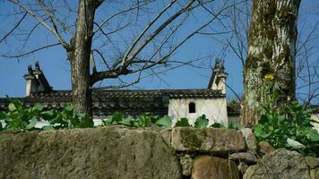 The beautiful traditional Chinese village view with the classical architecture and narrow lane  as background photo