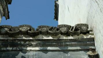 The old Chinese house carved with the beautiful stone sculptures in the countryside village of the China photo