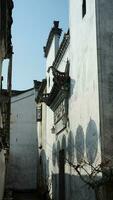 The old Chinese house carved with the beautiful stone sculptures in the countryside village of the China photo