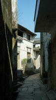 The beautiful traditional Chinese village view with the classical architecture and narrow lane  as background photo