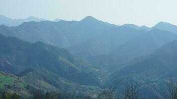 The beautiful mountains view from the top of the hill in spring photo